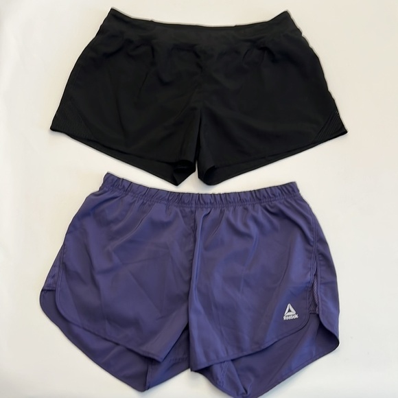 Reebok Pants - 2 pair Reebok speedwick running shorts 1 black 1 purple w/ built in panty size L